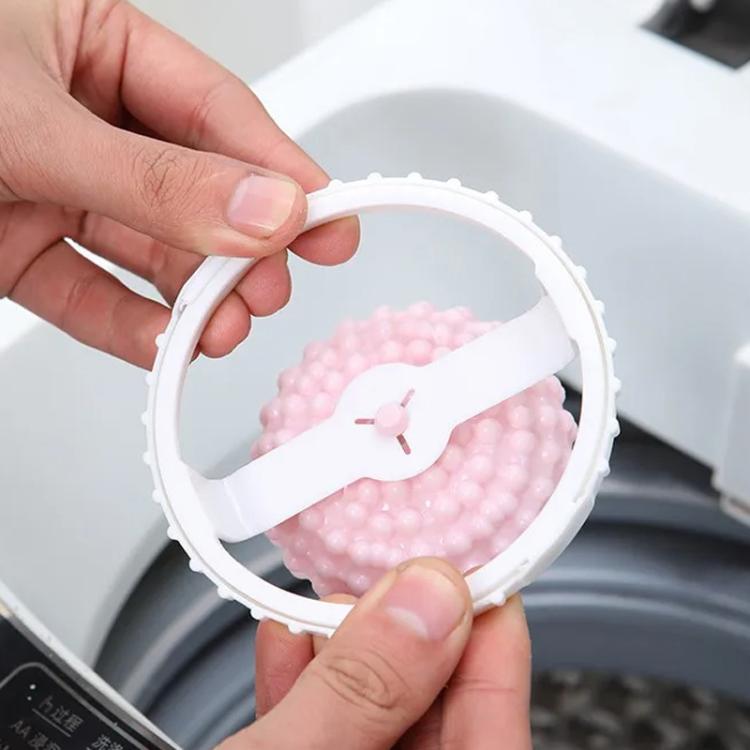 White hair lint catcher case open with pink studded ball inside, showing closing clip