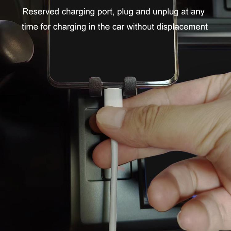 Car air vent phone bracket holding phone while allowing access to charging port