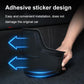 Black adhesive anti-kick pad with textured grip, being installed on rear seat