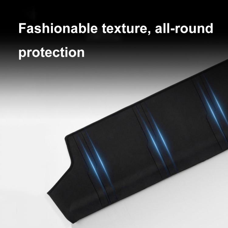 Black anti-kick pad with textured surface and stitched edge detail