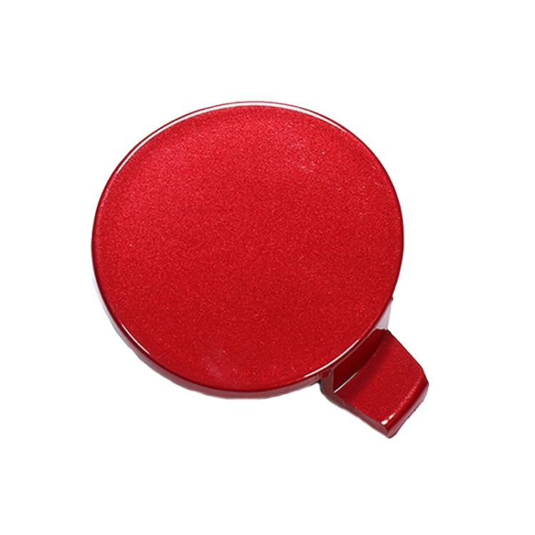 Red round front towing hook cover with hinged tab