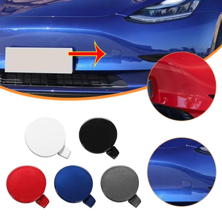 Red front towing hook cover installed on vehicle bumper, plus spare covers