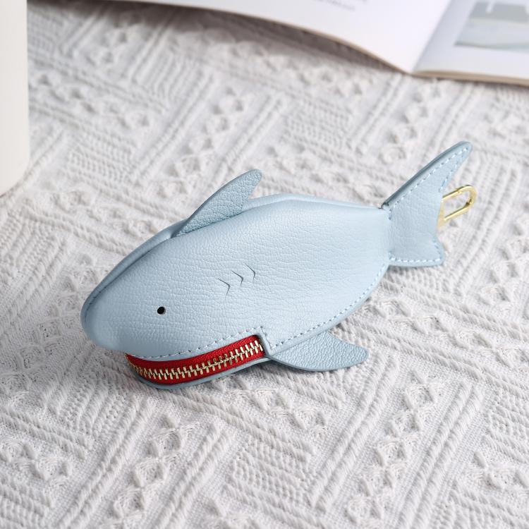 Light blue shark-shaped key cover with red zipper and gold key ring