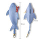 Light blue shark-shaped key cover, side view with red zipper and key clip