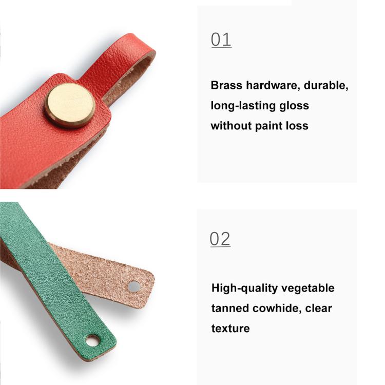 Red and green leather lanyard keychains with round brass snaps, close-up view.