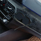 Adhesive car glasses case in black, attached near the center console