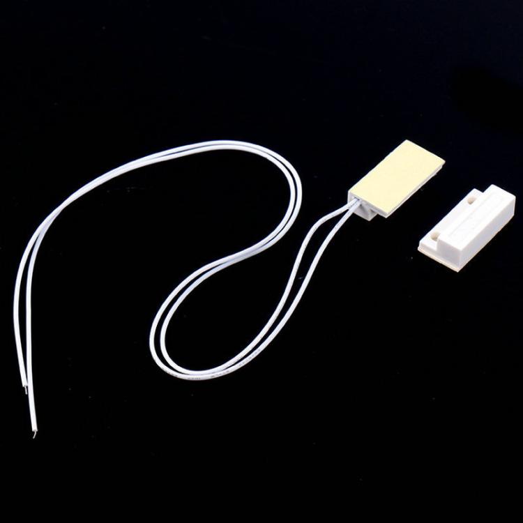Magnetic door contact switch set with two white sensor blocks and white wire leads