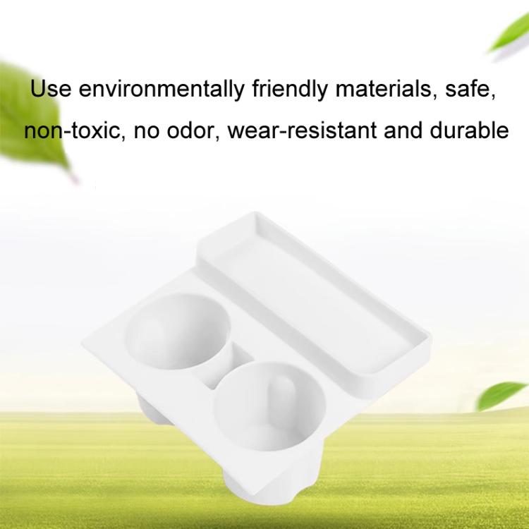 White silicone dual cup holder insert with side tray, shown on a tabletop