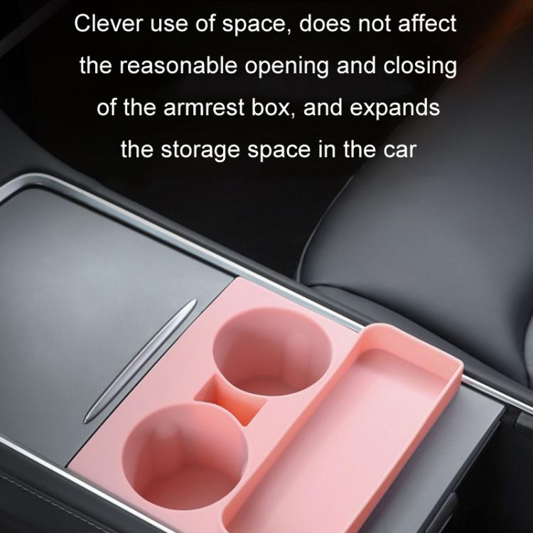 Pink silicone dual cup holder tray insert installed in car center console
