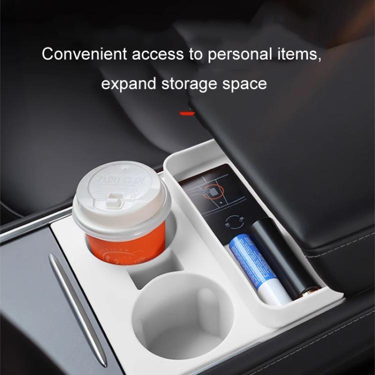 White silicone dual cup holder insert installed in car armrest storage area