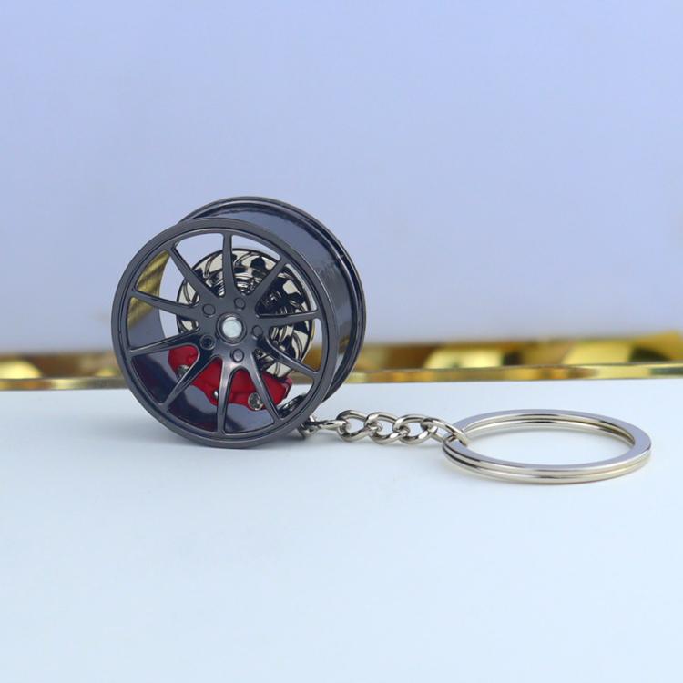 Wheel hub brake keychain with black rim and red brake caliper, silver key ring