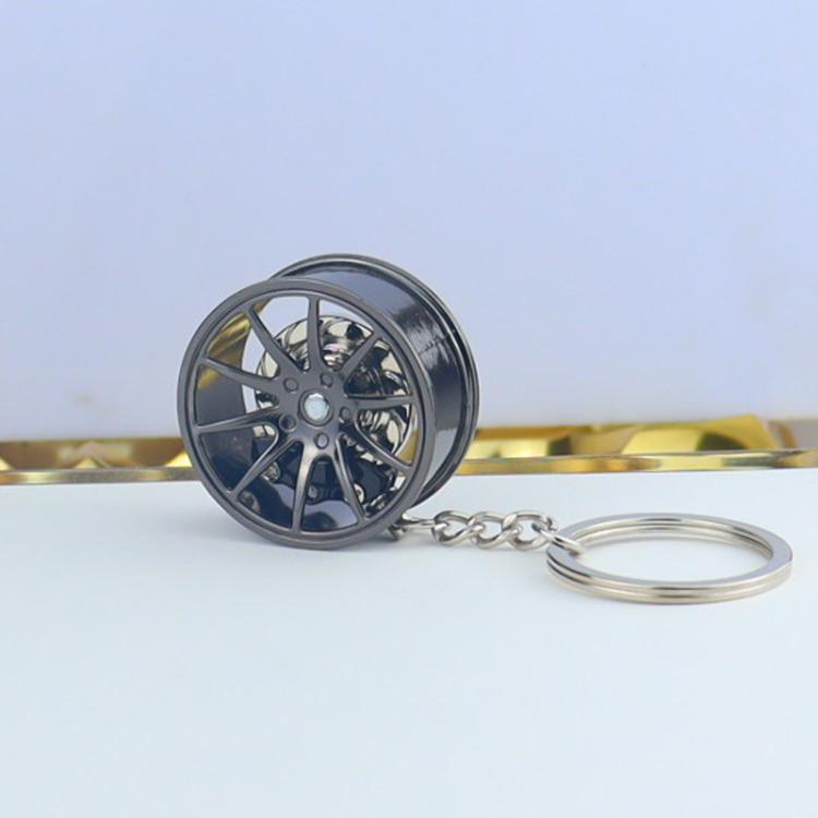 Wheel hub brake keychain with black rim and blue brake caliper, extended key ring