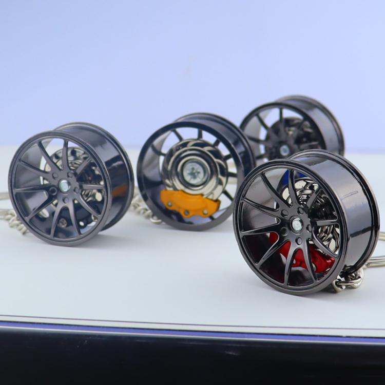 Metal wheel hub brake keychain set of five, with black rims and colored brake calipers