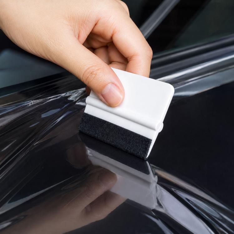 Car film scraper tool with white handle and black felt pad for anti-scratch use