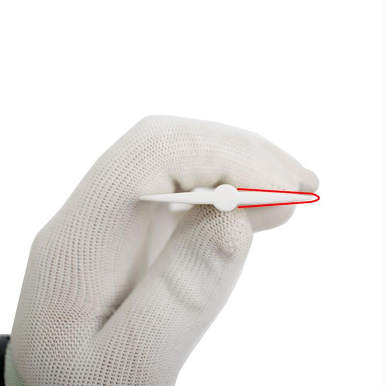 Car detailing felt scraper held in glove, white body with black abrasive pad