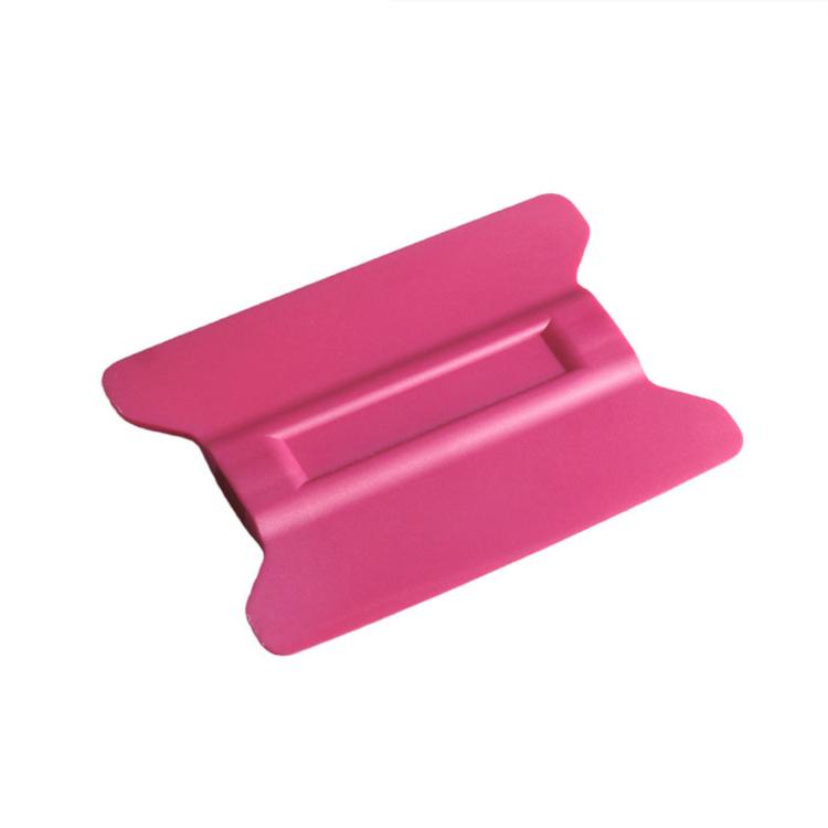 Pink plastic winged car film scraper tool with magnetic backing