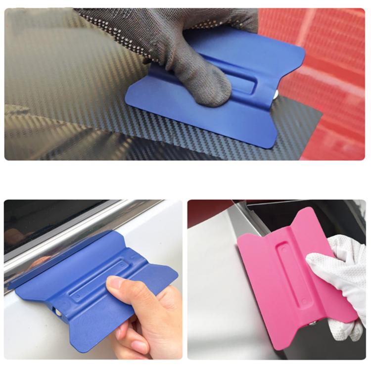 Blue and pink winged car film scraper tools used on car window glass