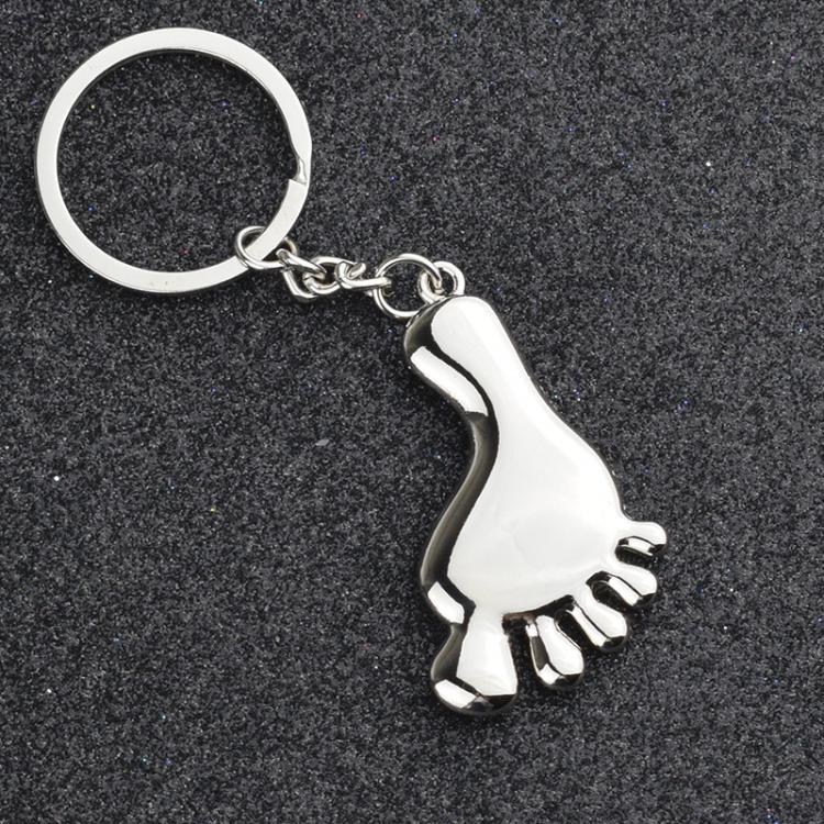 Silver metal foot-shaped keychain charm with chain and loop keyring