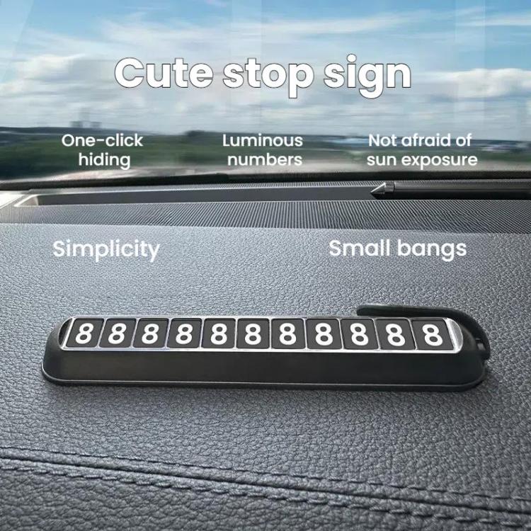 Car temporary parking number plate on dashboard surface, black housing with digits