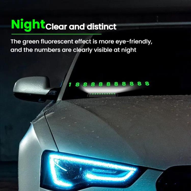 Car temporary parking number plate with bright green digits on dark housing at night