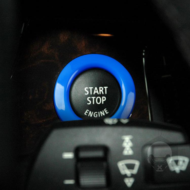 Blue start/stop engine button cover decoration ring installed on dashboard