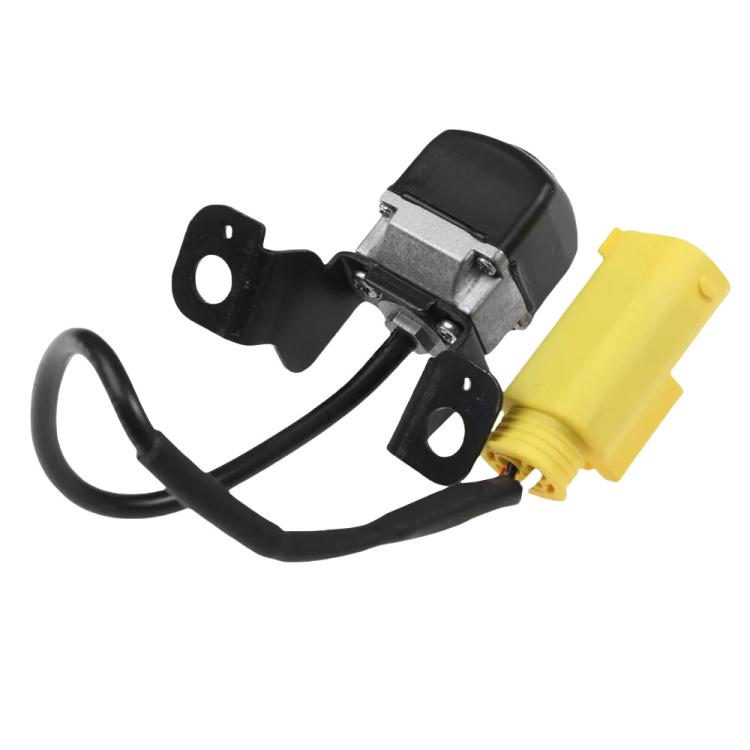 Rear view backup assist camera with black mounting plates, yellow plug, and wiring harness