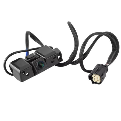 Reversing assist camera with black housing and attached wiring harnesses