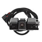 Reversing assist camera module with attached brackets and braided cable