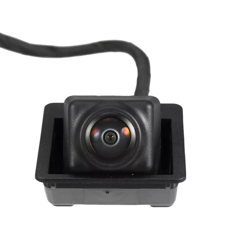 Square rear view camera module with round lens in black housing