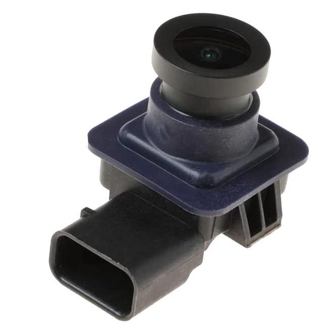 Rearview camera module with black lens and blue faceplate, plug connector attached