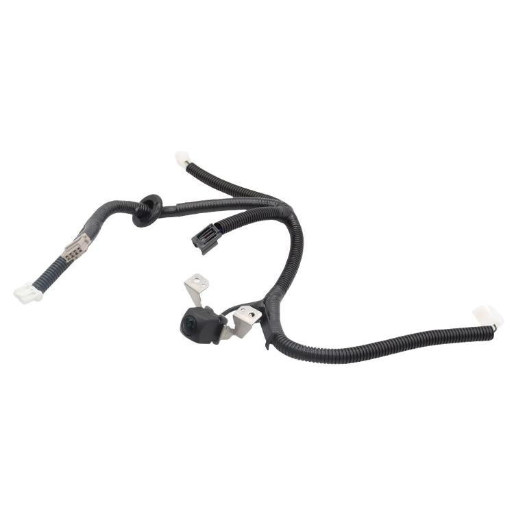 Rear view reverse assist camera wiring harness with camera module and mounting clips
