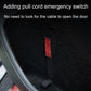 Red emergency pull cord tab on black interior door panel