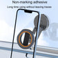 Non-marking adhesive car phone holder with round base and orange-ring magnet.