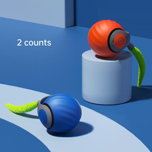 Orange and blue self-rolling cat ball toy with textured green catnip tail