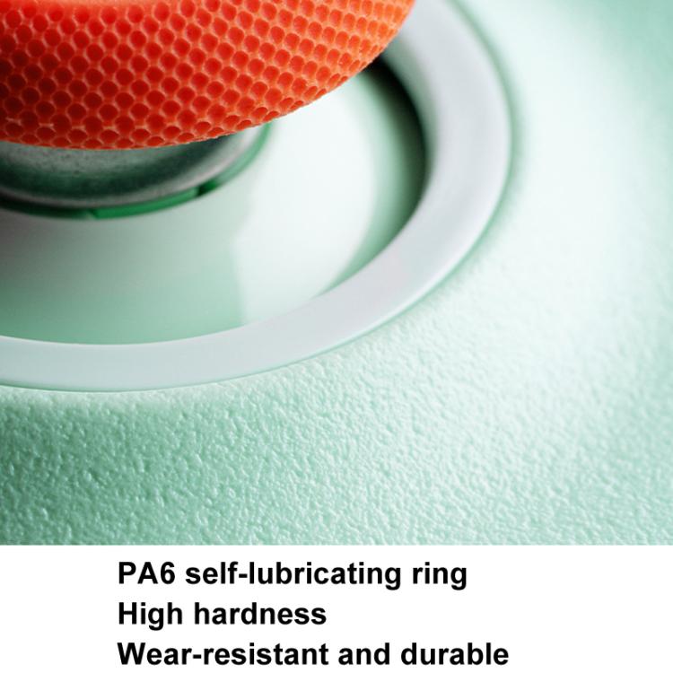 Wireless gaming controller detail: orange textured ring and green shell edge