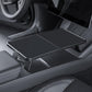 Folding tray table in car front center console, dark gray with textured grip pads