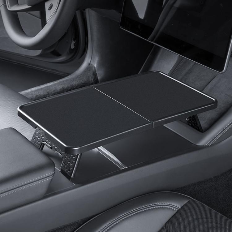 Folding tray table in car front center console, dark gray with textured grip pads