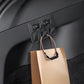 Car trunk side folding hooks, dark gray panel with bag strap hooked on