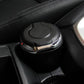 Black car cigarette ashtray seated in cupholder with glowing lid light
