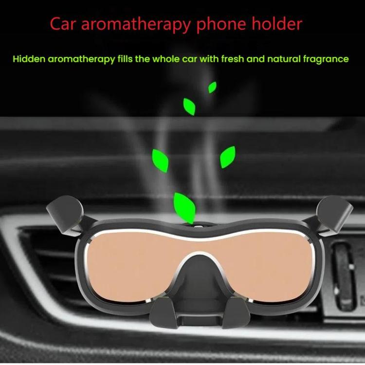 Car air vent phone holder with black eyeglass frame and beige tinted lenses in dashboard