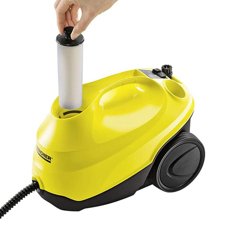 Steam cleaner water softener filter cartridge in yellow steam unit with black cap
