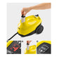 Hand inserting clear filter cartridge into yellow steam cleaner housing