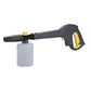 Handheld foam sprayer with white bottle, black handle, and yellow nozzle cap