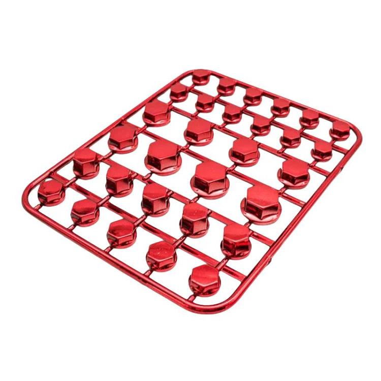 Red decorative hex screw caps in a plastic organizer tray
