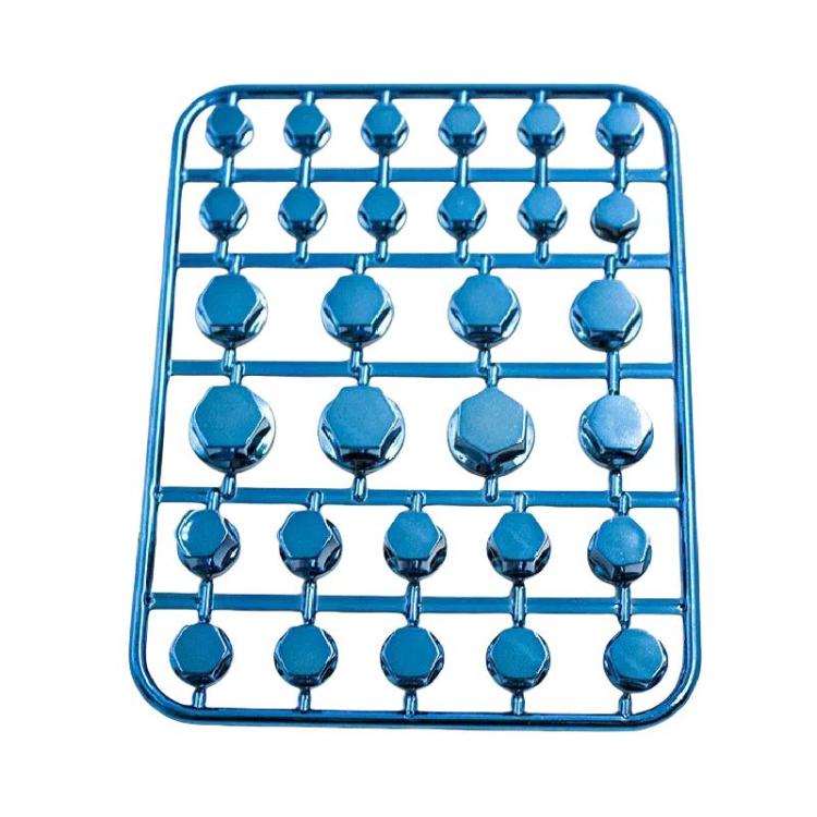 Blue decorative hex screw caps on a sprue-style mounting tray
