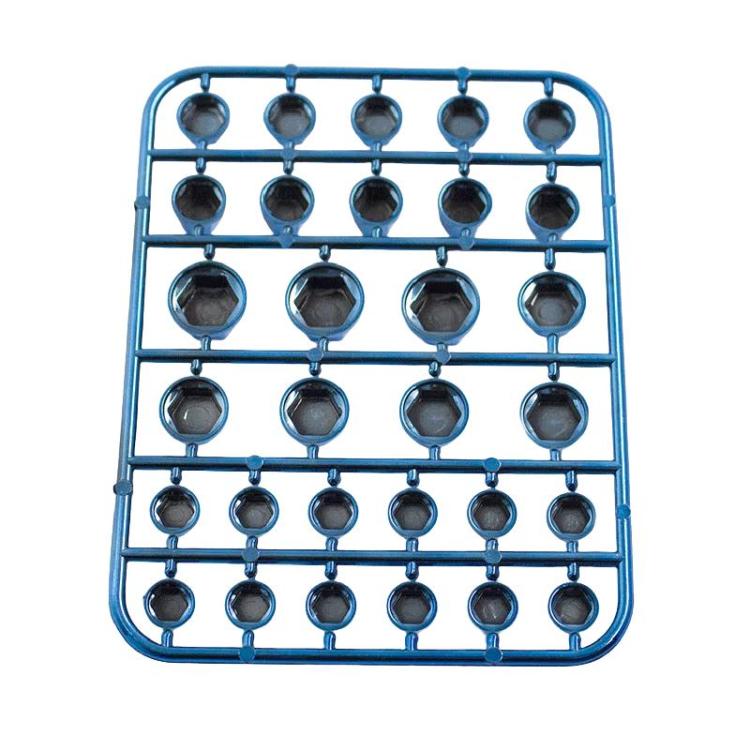 Dark blue decorative hex screw caps on a sprue-style mounting tray