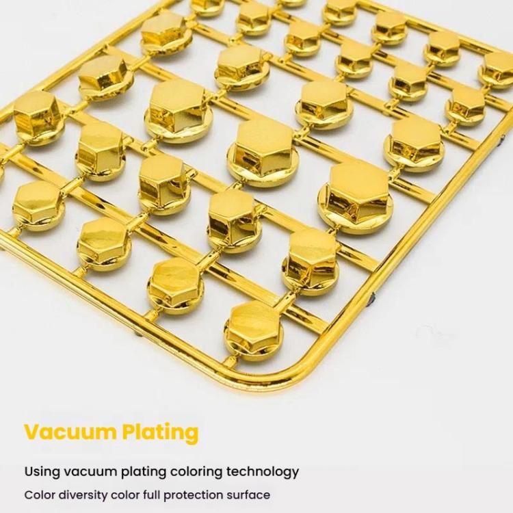 Golden decorative hex screw caps in a plastic mounting tray close-up