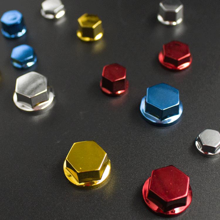 Assorted hex decorative screw caps in blue, red, gold, and silver colors
