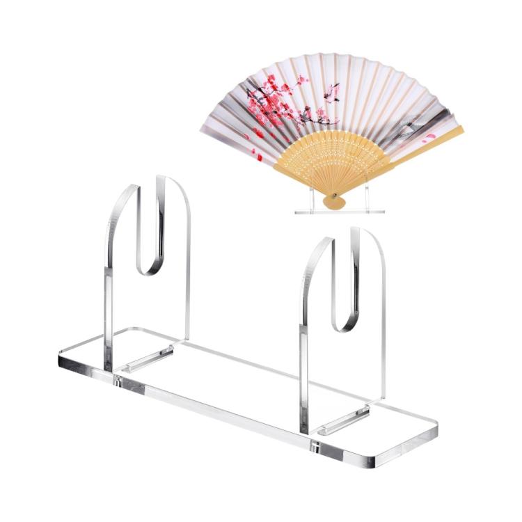 Clear acrylic folding fan display stand holding a folded paper fan on base