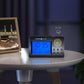 Black AL-HARAMEEN digital desk clock on tabletop with illuminated display